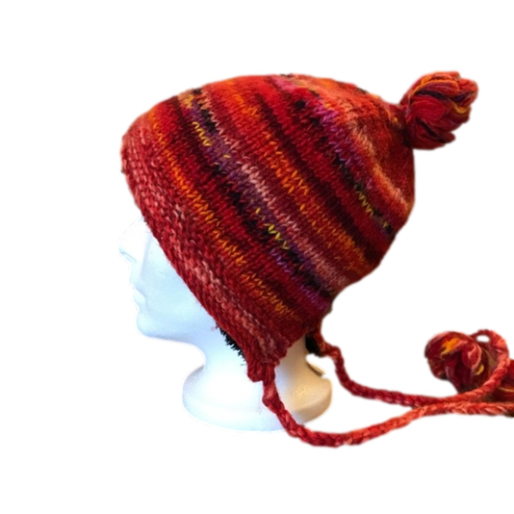 KYBER knitted winter hat/ toque. Shades of red and orange. Made in Nepal.